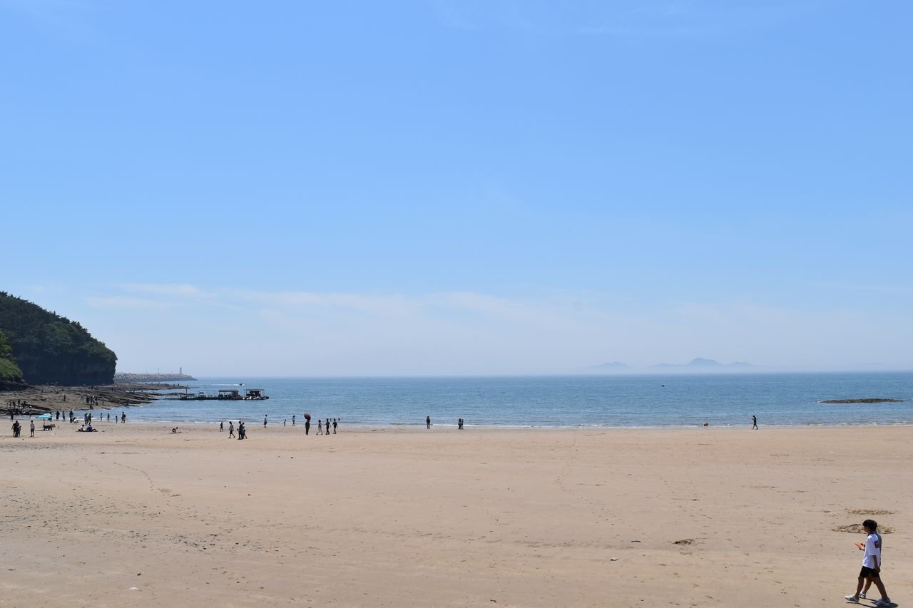 Chaeseokgang cliffs beside the sand at Gyeokpo Beach